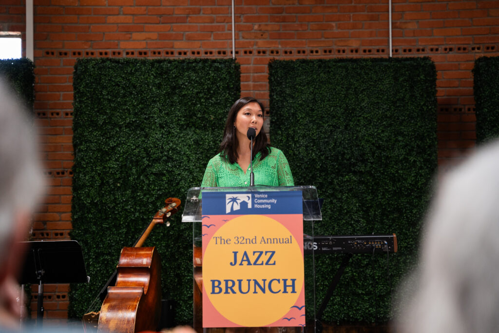 A photograph of Erika at Jazz Brunch podium
