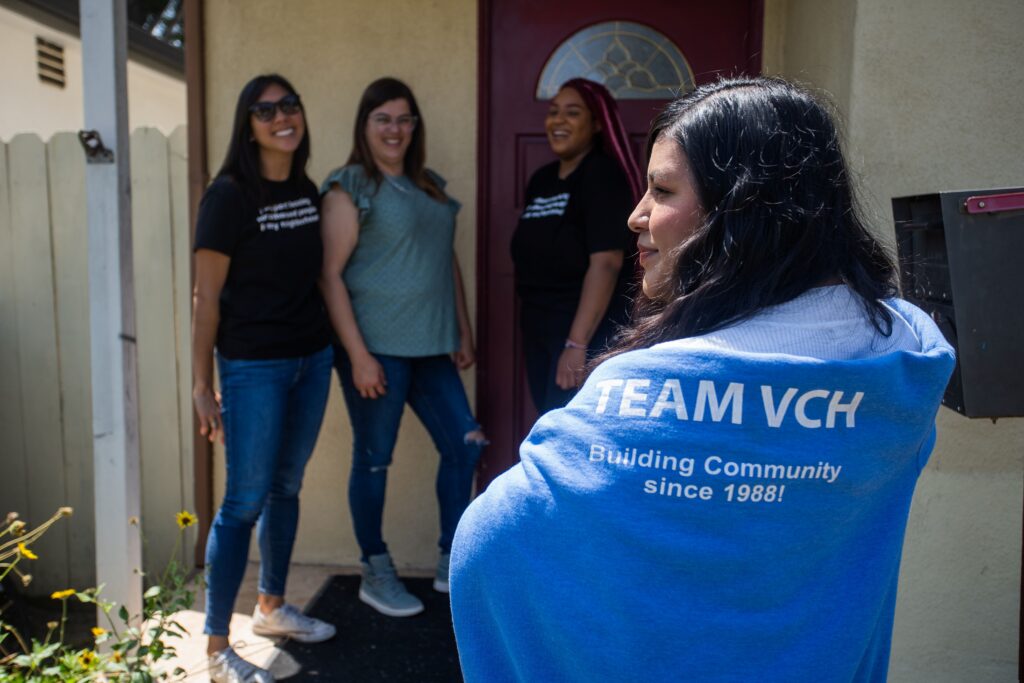 Staff member wearing TEAM VCH sweatshirt